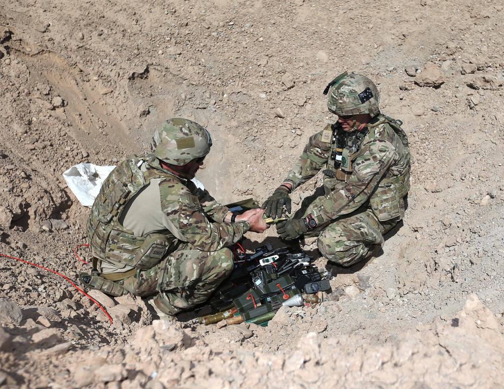 1 Explosive Ordnance Disposal Troop personnel prepare to detonate ordnance on the Multi Nation...jpg