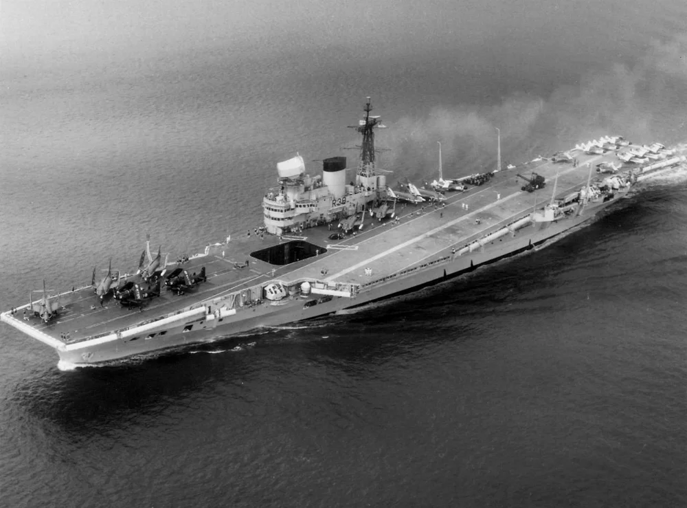 1280px-HMS_Victorious_%28R38%29_aerial_c1959.webp