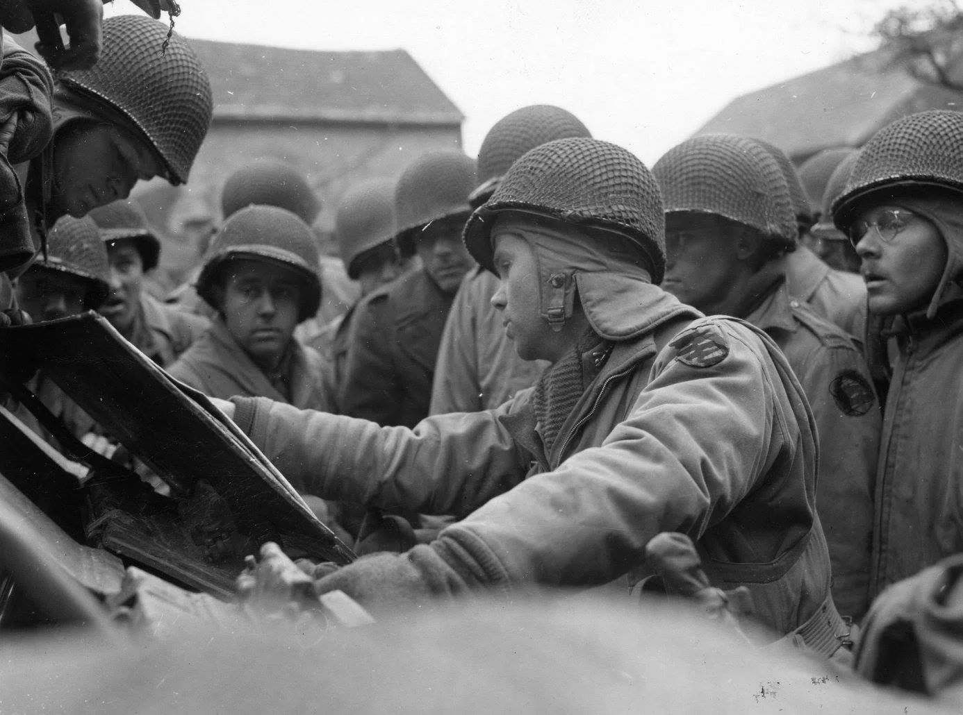 2nd Lt Eugene Rouke briefs his platoon for an assault on November 16, 1944 west of Cologne.webp