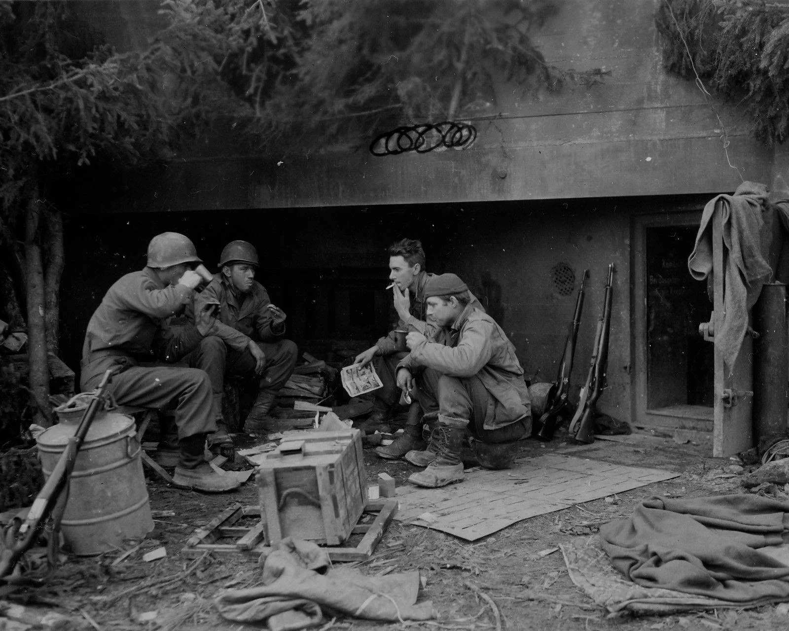 6th Armored Division GI_s Grab Chow by German Bunker 1945..webp