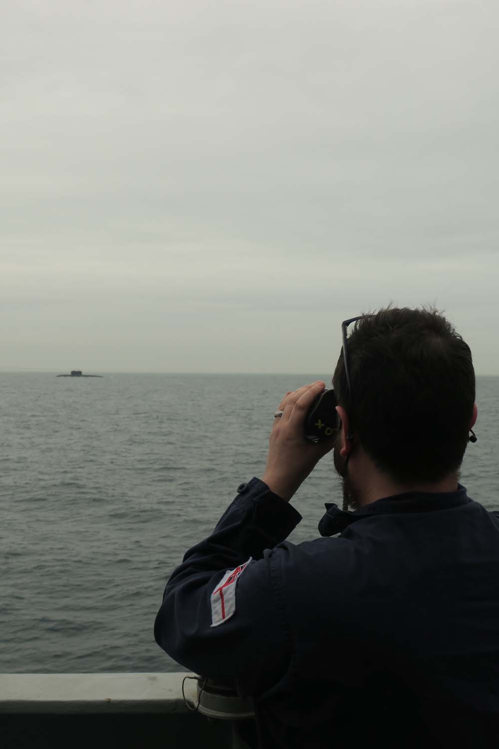 A Royal Navy sailor monitors activity.jpg