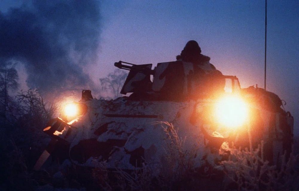 a-soldier-mans-the-m-2-50-caliber-machine-gun-atop-an-m-113-armored-personnel-7c0917.jpg