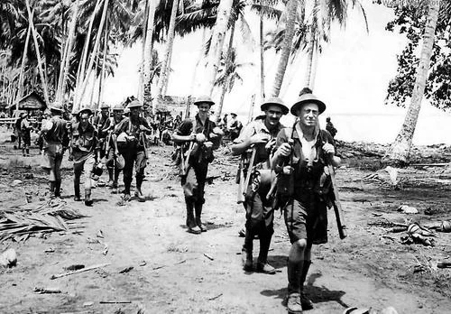 aAustralian_troops_advance_from_Gona_toward_Buna_New_Guinea_1943.webp