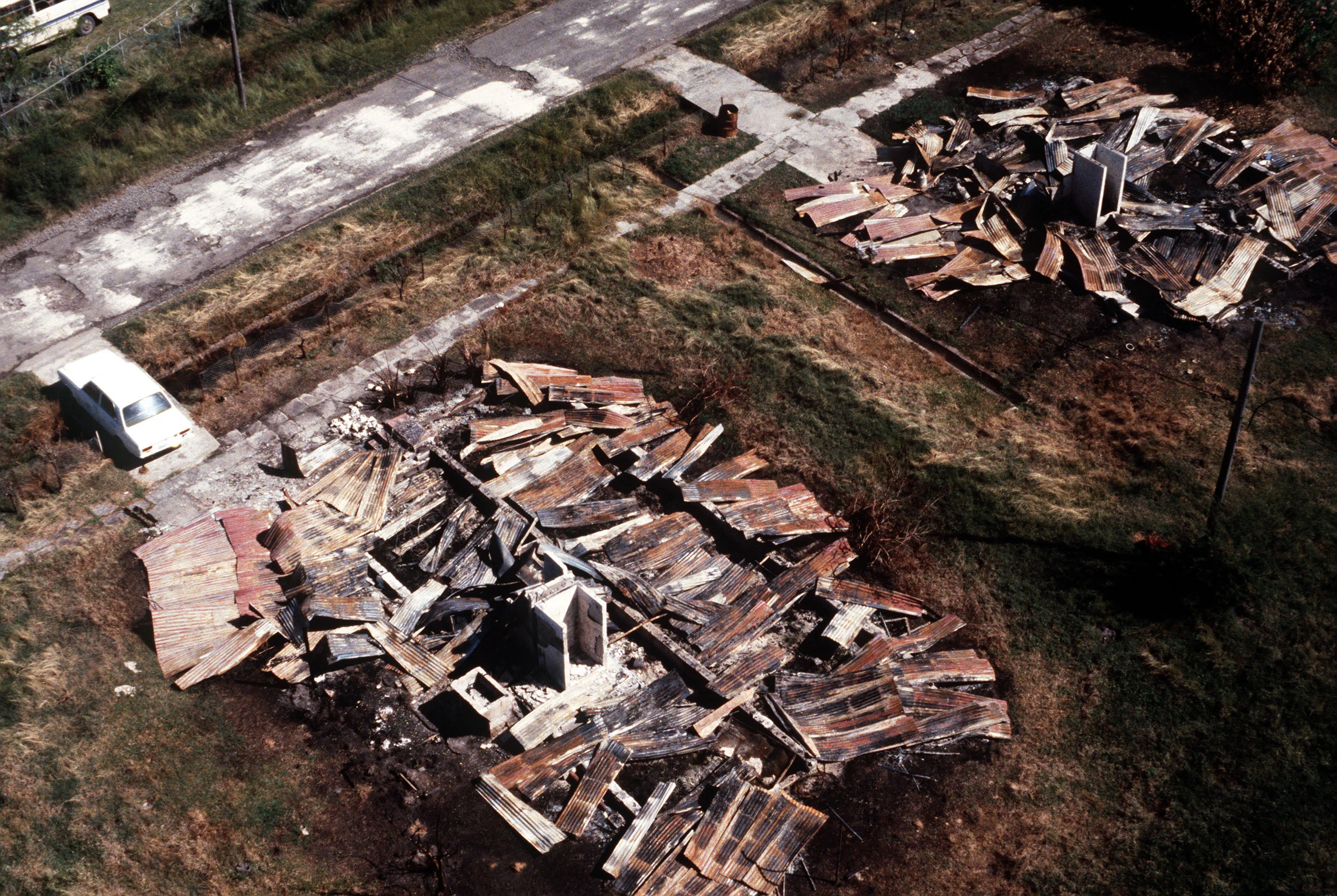 an-aerial-view-of-two-buildings-destroyed-during-operation-urgent-fury-7b9669.jpg