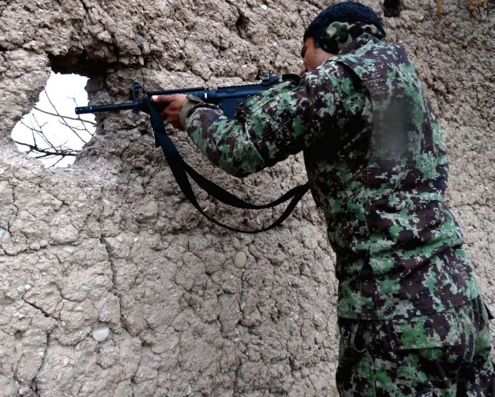 an-afghan-security-force-member-takes-position-371484.jpg