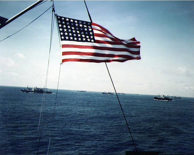 An American flag flew on a convoy ship while underway, location unknown, circa 1943-1945.webp