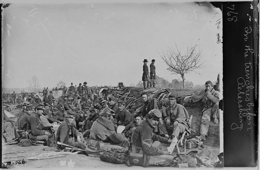 civil-war-people-huddled.webp