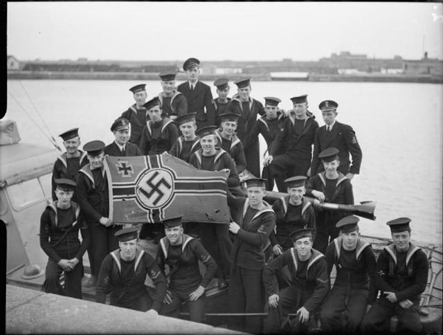 Crew of the MGB Flotilla with a captured Nazi ensign.jpg