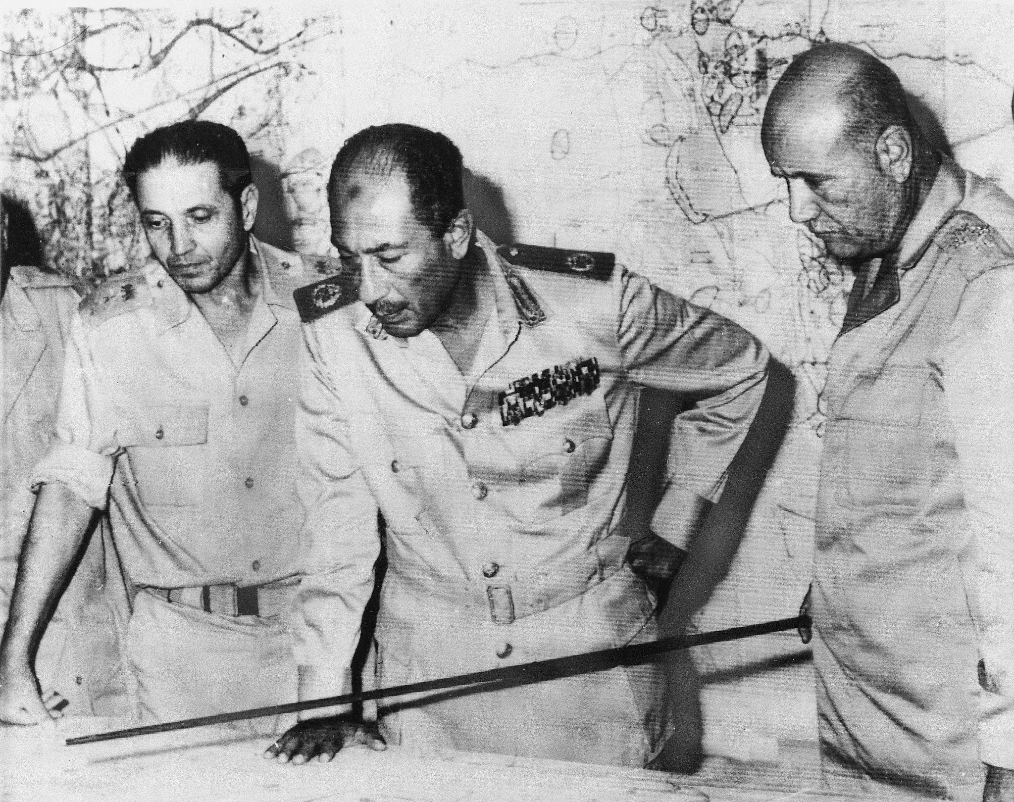 Egyptian President Anwar al-Sadat is flanked by Chief of Staff Sadedin Shazli, right, and War...webp