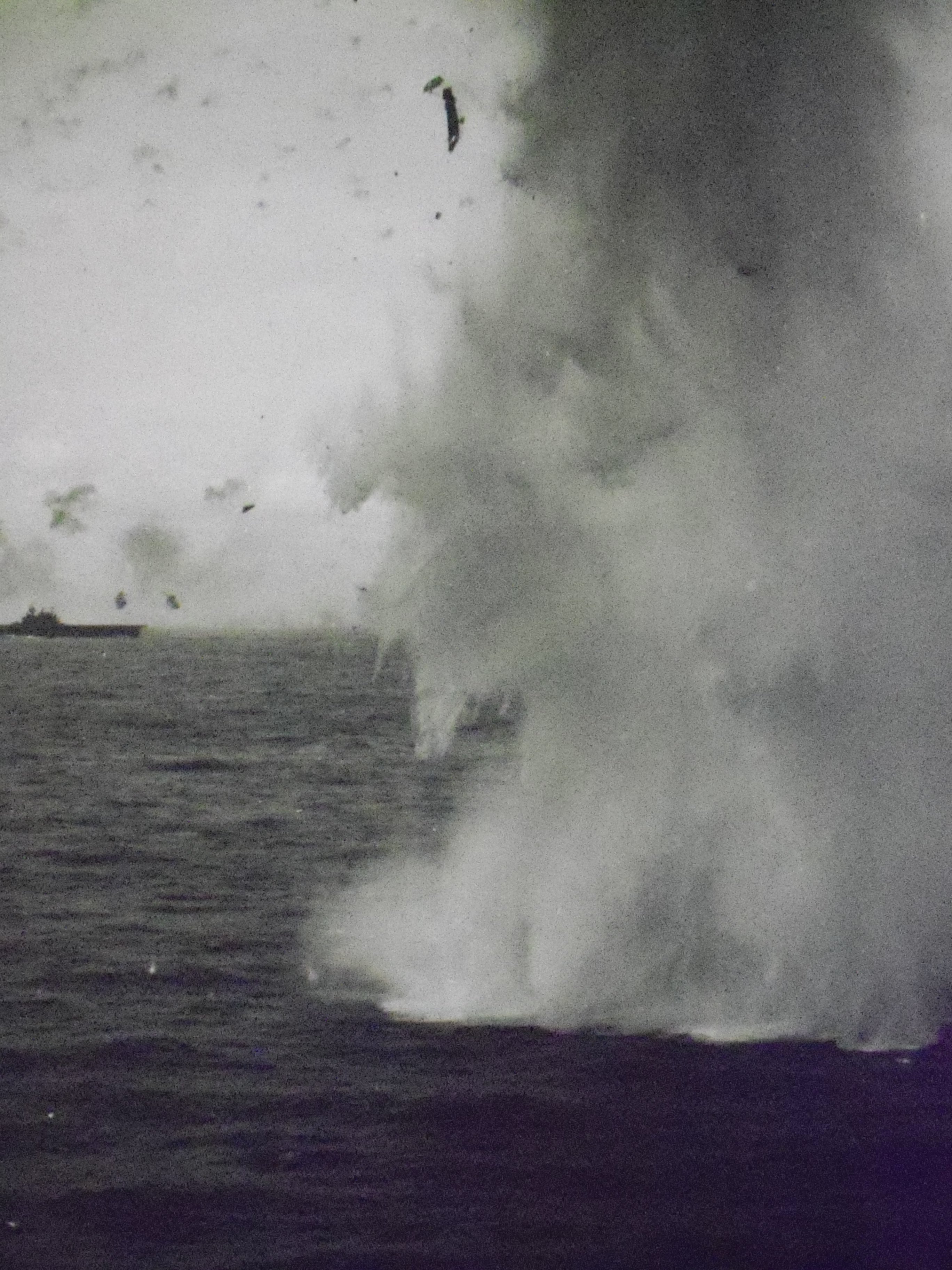 Essex CV-9 062 MP Kamikaze crashes off the stbd side. Enterprise can be seen in the background...JPG