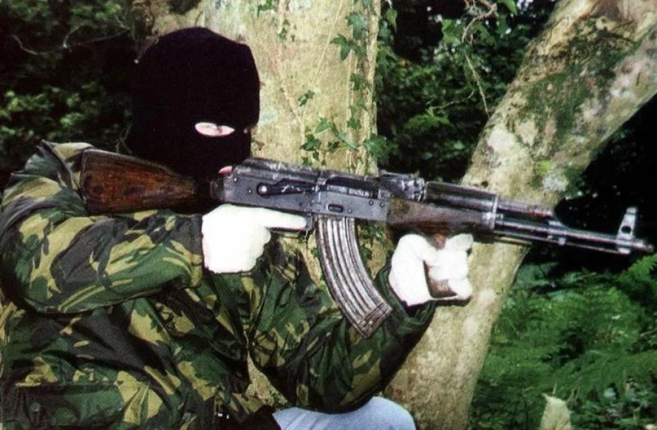 file_photo_of_an_ira_member_posing_with_ak_47_assa_4f59a24b8b.webp