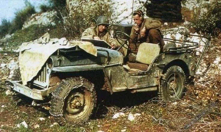 G.I's using a radio in a jeep Italy 1944.webp