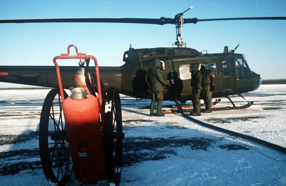ground-support-personnel-at-allen-army-airfield-refuel-a-uh-1-iroquois-helicopter-de8f7e.jpg
