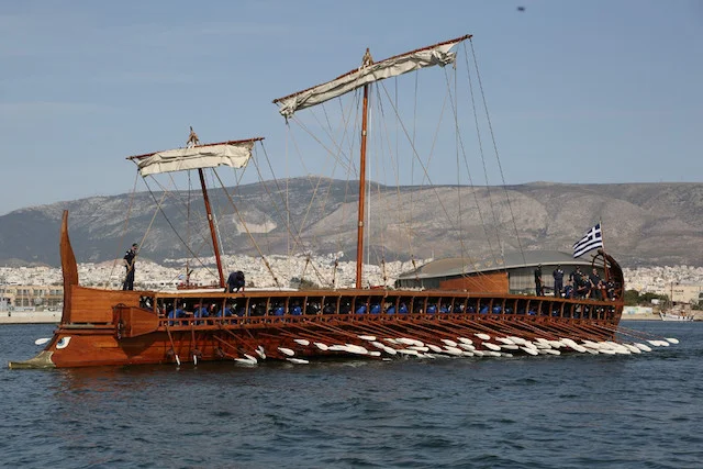 Hellenic_Navy_launched_trireme_Olympias_back_to_sea.webp