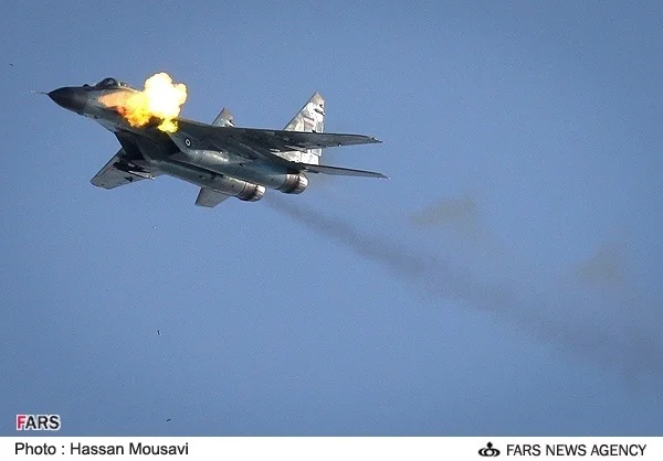 IRIAF MiG-29 (9-12) firing canon.webp