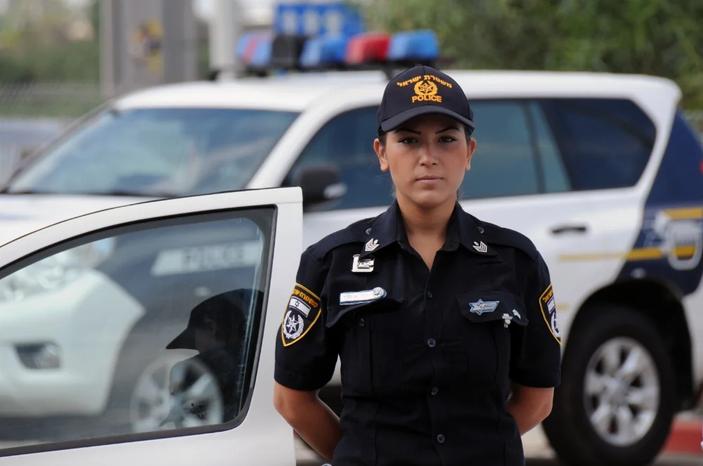 Israel-Police-Officer-and-Police-Car.webp