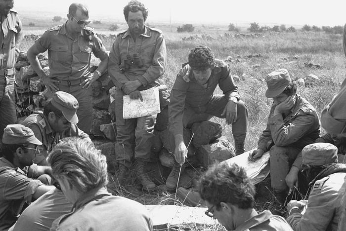 Israeli officers pour over maps during one of the battles of the 1973 Yom Kippur War .jpg