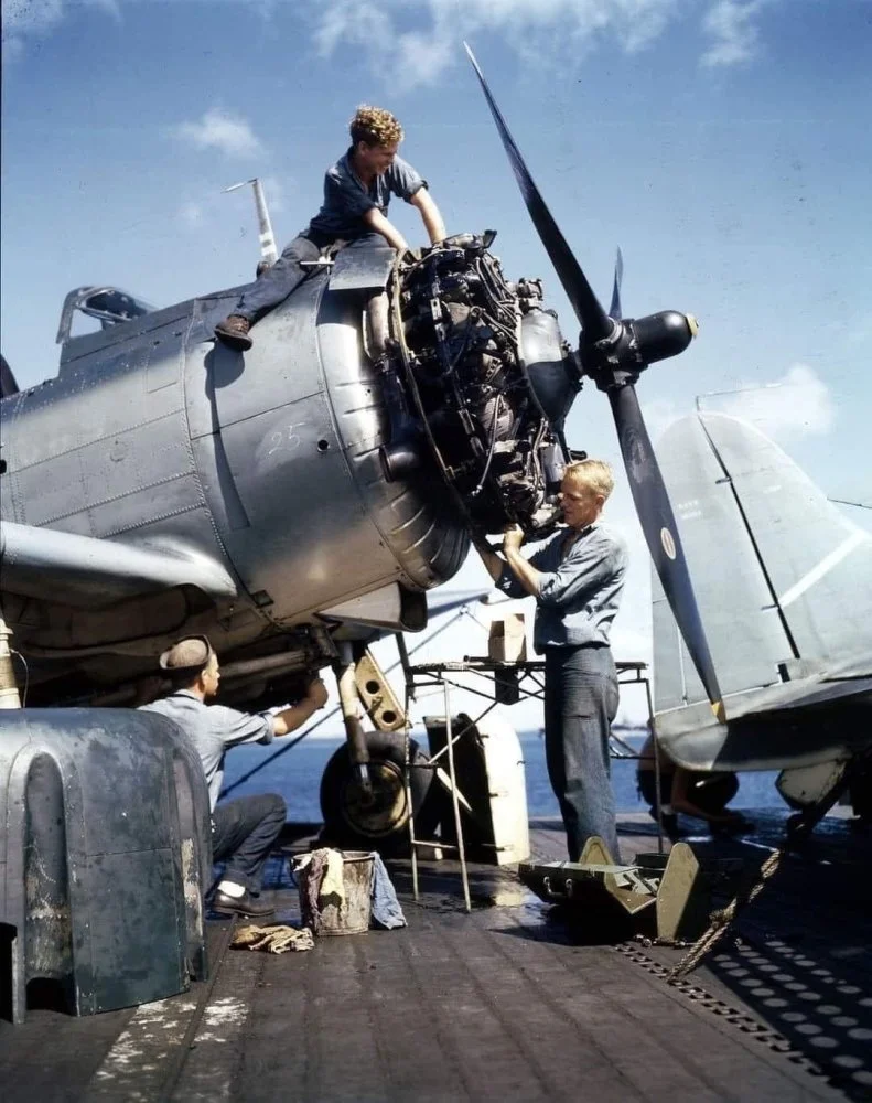 Mechanics Overhaul the Engine of Dauntless at sea.webp