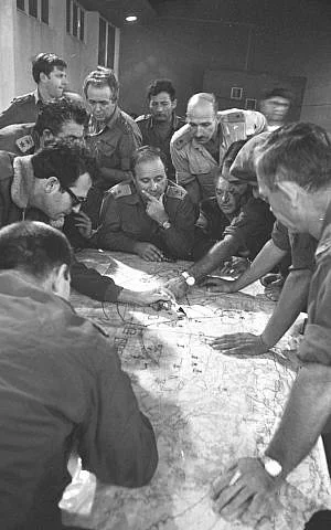 Members of the IDF General Staff look over a map during the outbreak of the Yom Kippur War on...webp