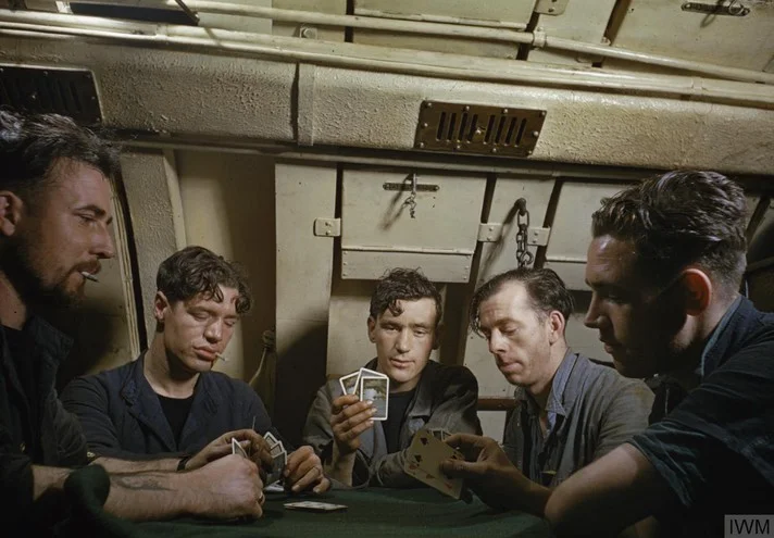 Men of the Royal Navy play cards.webp