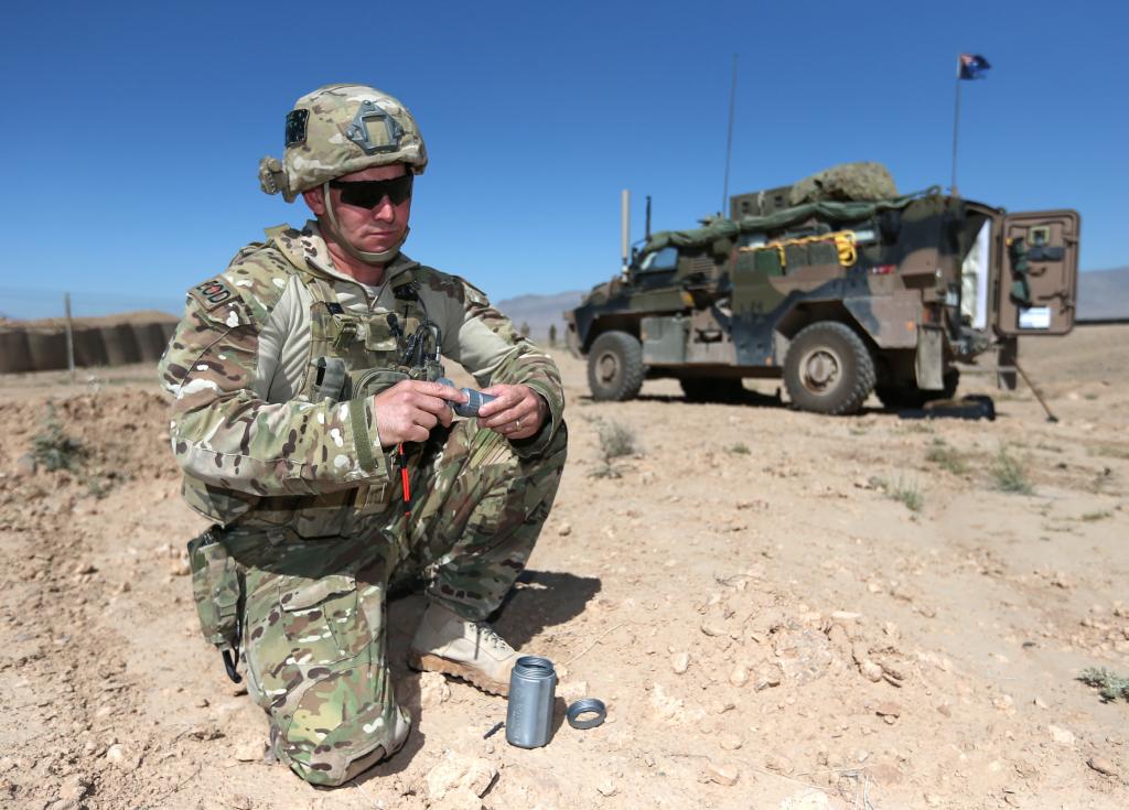 Ordnance Reconnaissance Technician Corporal Mark Fitness prepares a training explosive charge ...jpg