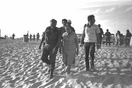 Prime minister Golda Meir touring the southern front with Maj. Gen. Ariel Sharon several days ...jpg