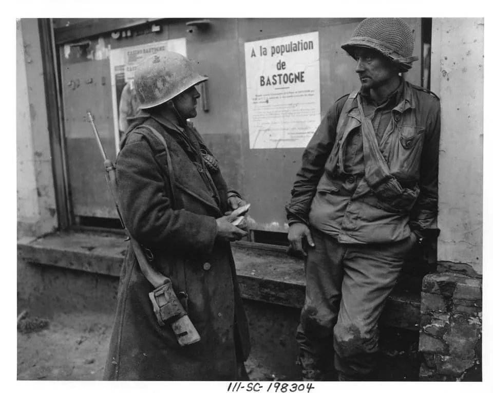 Pvt Adam H Davis and T:S Milford A Sillars. Dec 19 1944” US Army Signal Corp Photo.webp