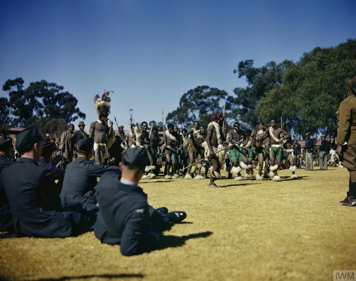 RAF cadets watching a Zulu war dance.webp