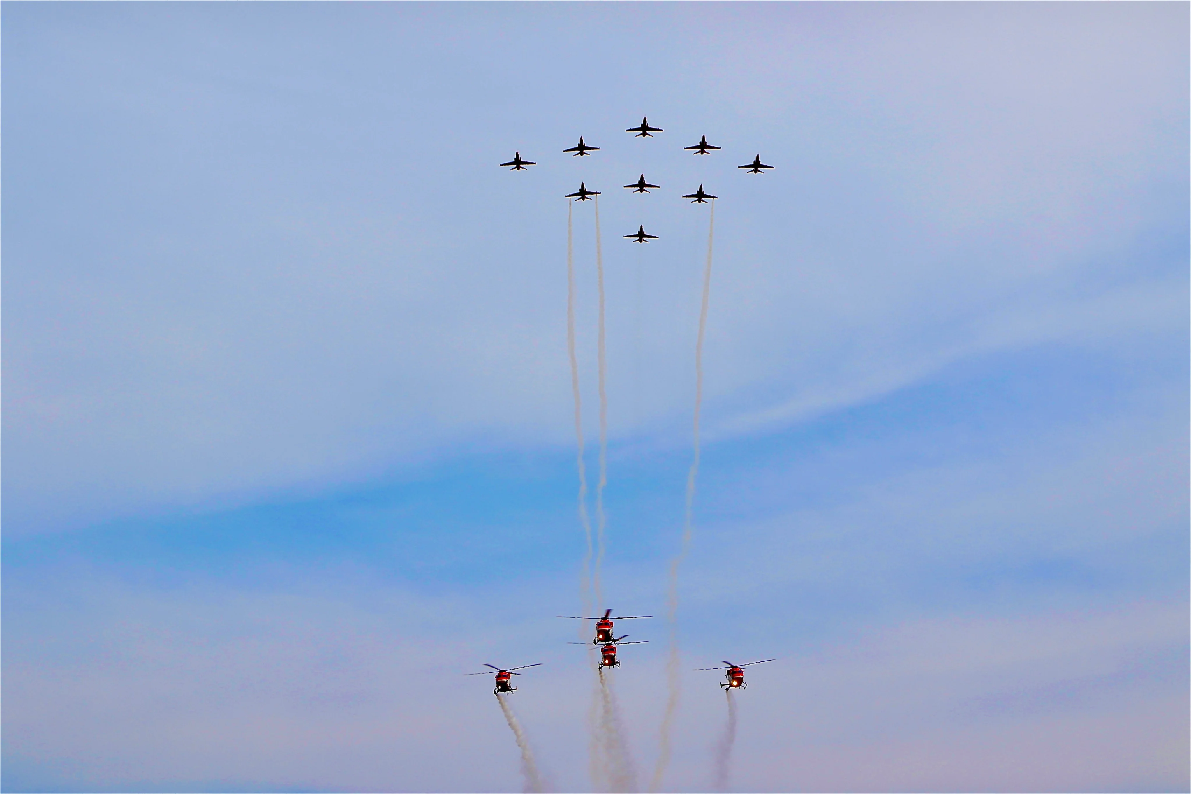 sarang-the-four-helicopter-display-team-and-suryakiran-the-nine-aircraft-aerobatic-team-perfor...jpg