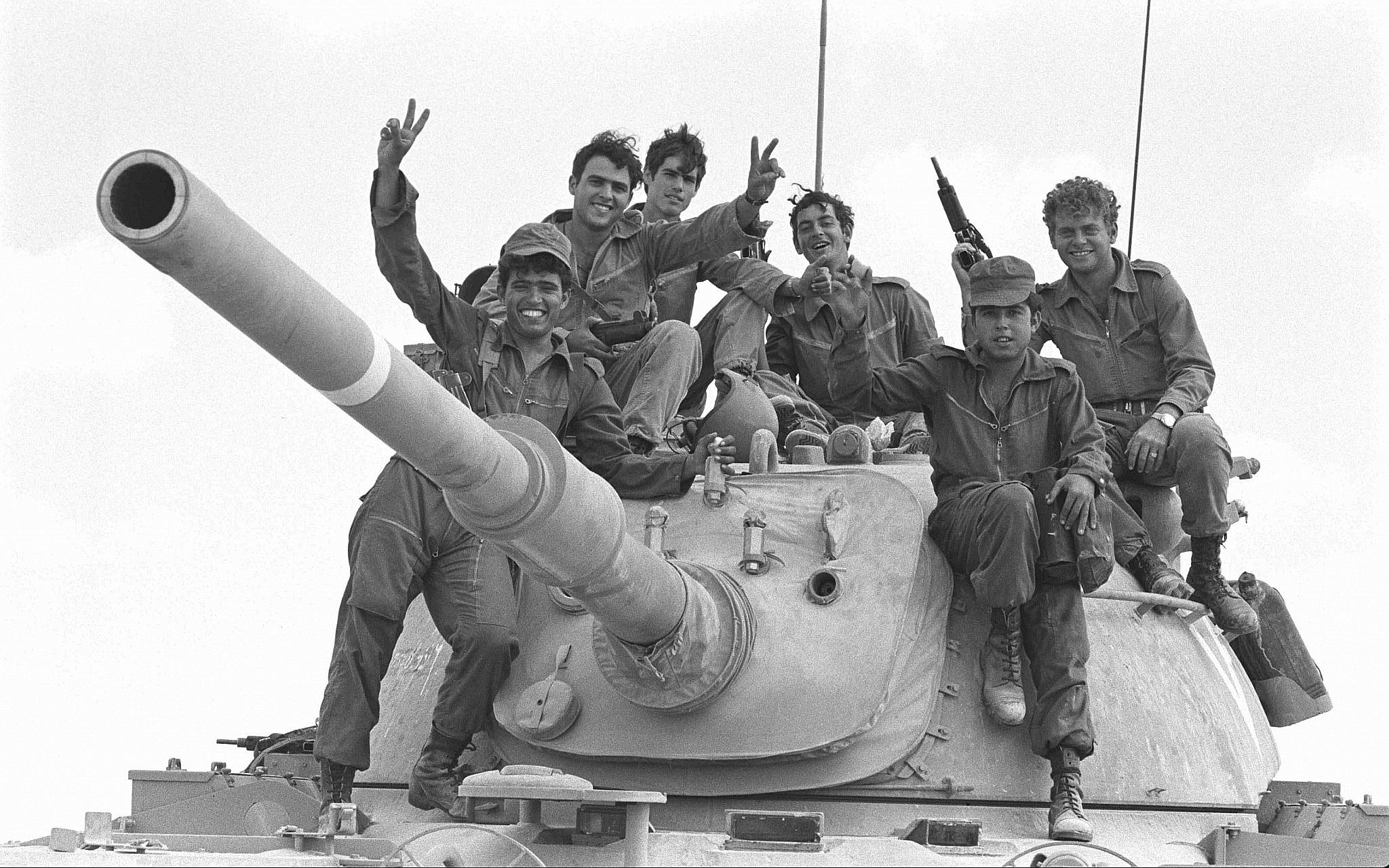 Soldiers pose on top of a tank during the outbreak of the Yom Kippur War on October 6, 1973. .jpg