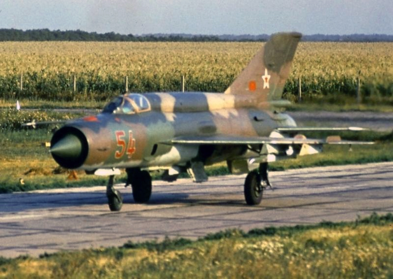 Soviet MiG-21bis (54 red) fitted with R-13M launcher taxiing.jpeg