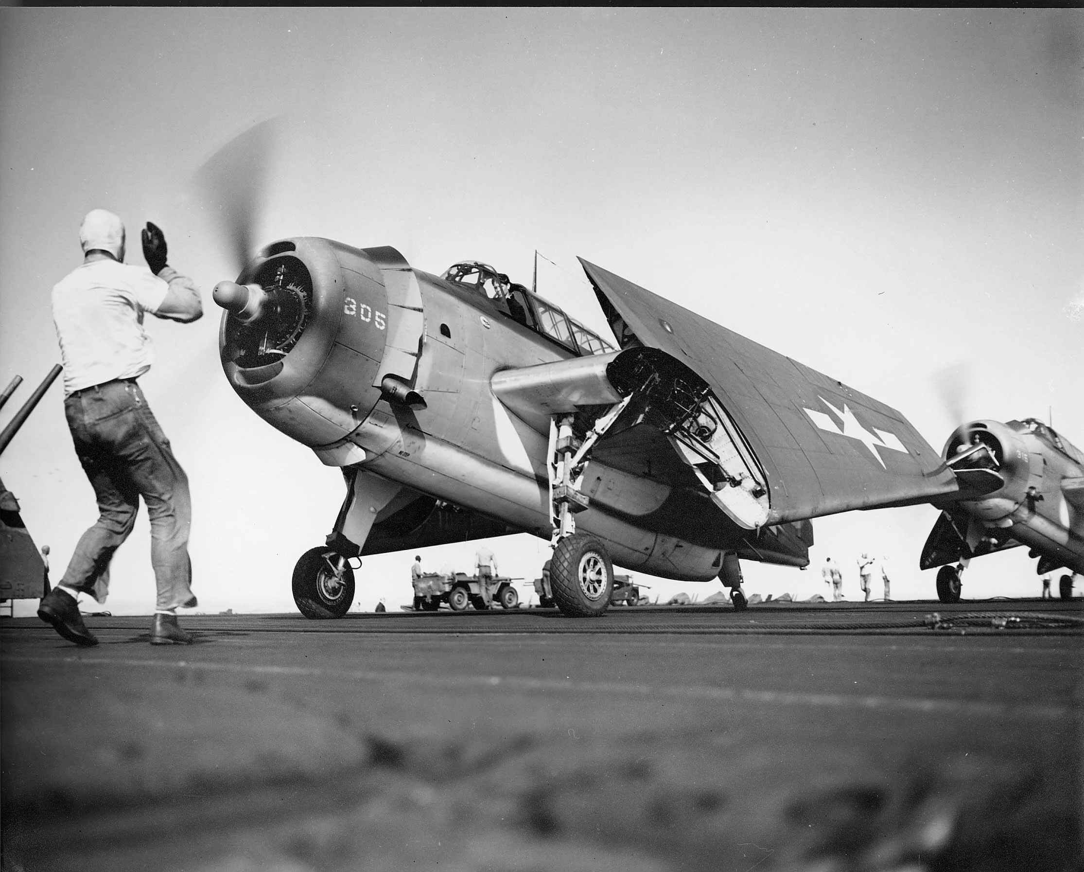 TBM-3 of Torpedo Squadron Eighty-Three taxing on the deck of USS Essex (CV-9).jpg