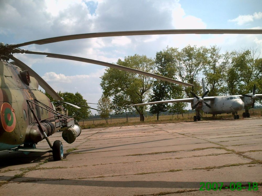 Transnistria Mi-8 (6 yellow) & An-26 at Tiraspol airport (18 August 2007).jpg