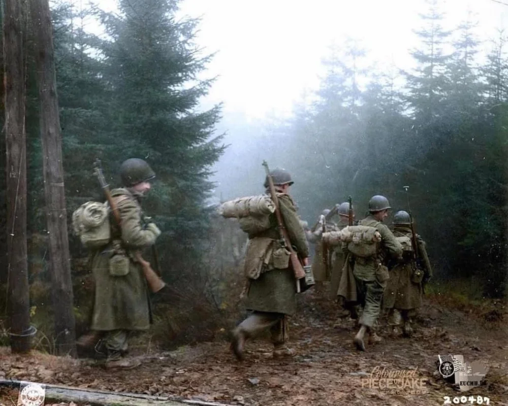 US 82nd Airborne move through the fog in the Ardennes in December of 1944.webp