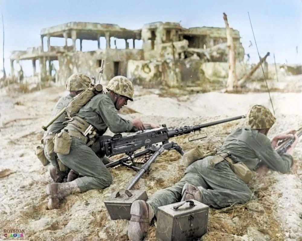 US Marines load and prepare a 50 caliber machine gun.webp