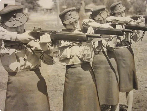 USMCWR Marines pose with Reising M50 submachine guns, circa May 15, 1943.webp