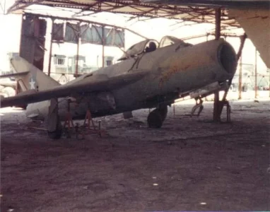 Somali MiG-17 derelicted in hangar.webp