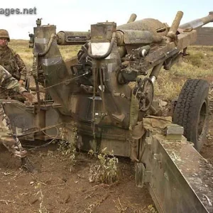 U.S. Marines fire a 155mm howitzer