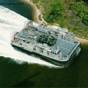 LCAC 50 carrying a tank in shallow water