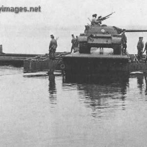 Engineers using ponttoon ferry to transport a tank