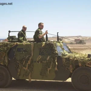 Danish soldiers driving an Eagle