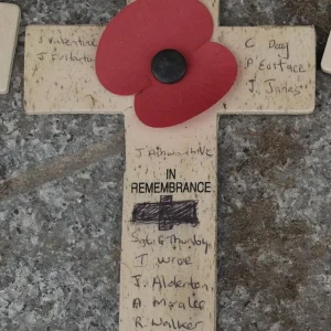 Poppy Cross. Many names inscribed on it.