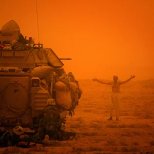 Bradley Fighting Vehicle covering an Iraqi