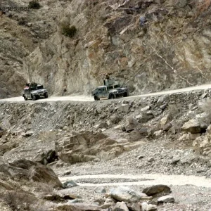 HMMWV's drive through a narrow roads