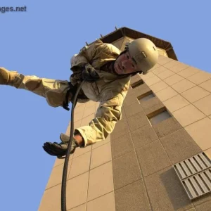 Senior Master Sgt. performs a rappelling exercise