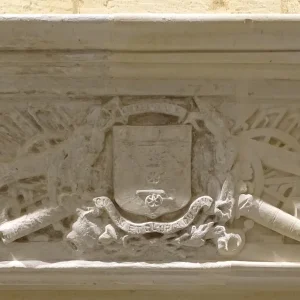 Artillery carving on a mantel of a fireplace