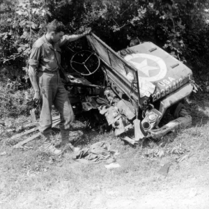 American Willys Jeep (Willys), or what's left of it after hitting an anti-tank mine on the ro...jpeg