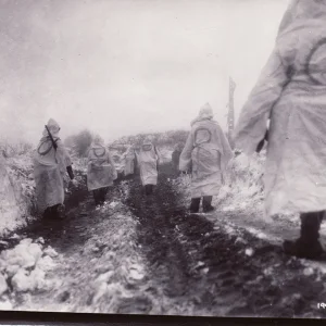 000-Riflemen of the 2nd Infantry clad in snow camo head out on patrol near Krinkelt.  The O on...jpg