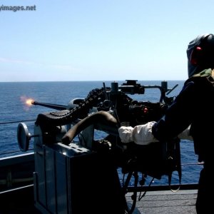 Seaman fires a MK-38 25mm machine gun system