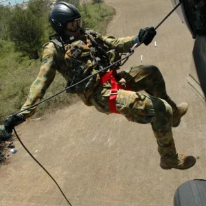 Petty Officer rappels from a MH-60S Seahawk